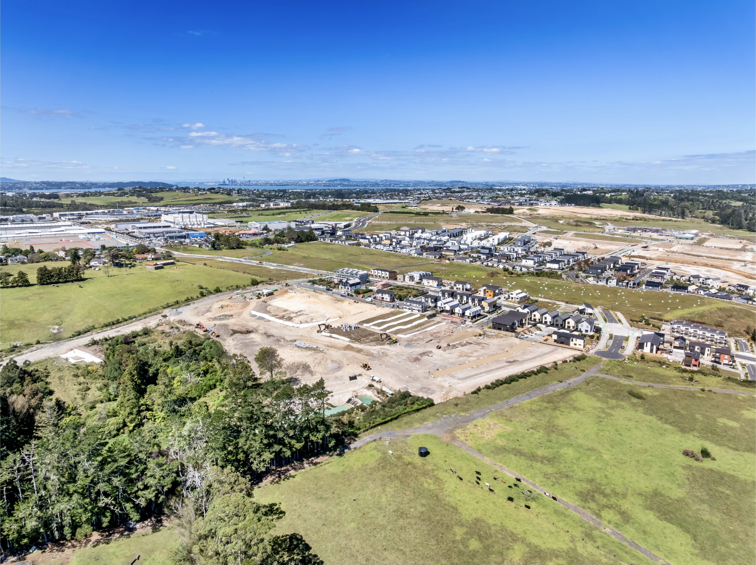 Aerial view across the Westgate development toward Auckland